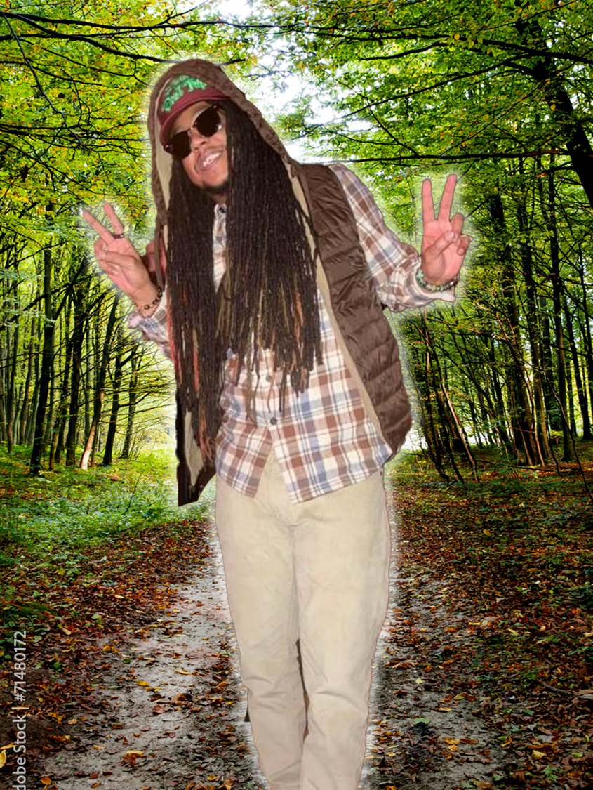 Kenny on a forest path, arms wide open, giving peace signs to the world